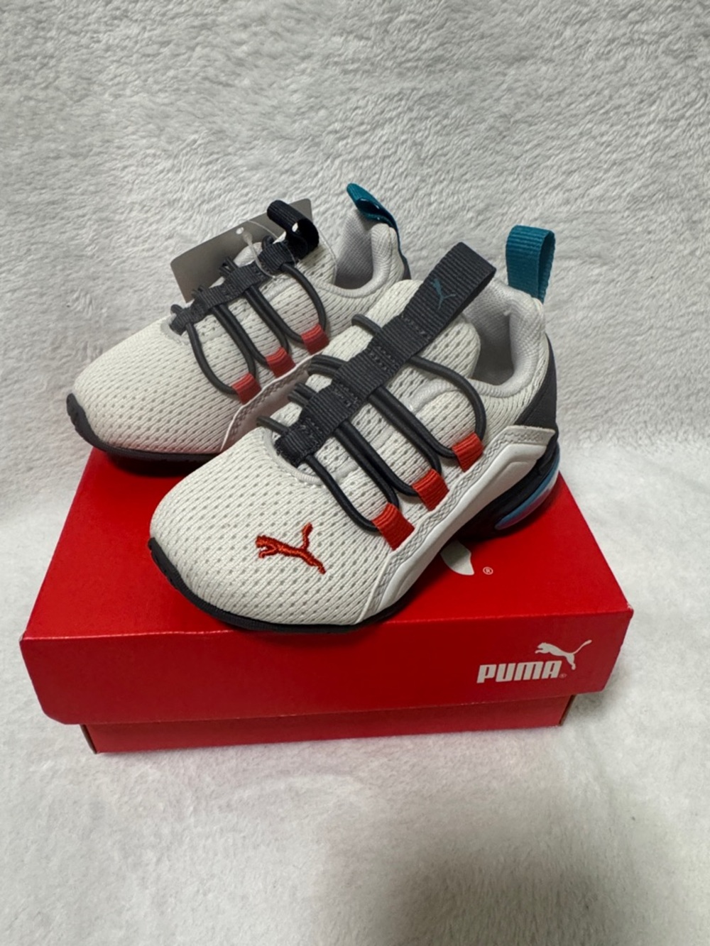 Puma Kids White, Black & Red Sneakers with Teal Pull Tab